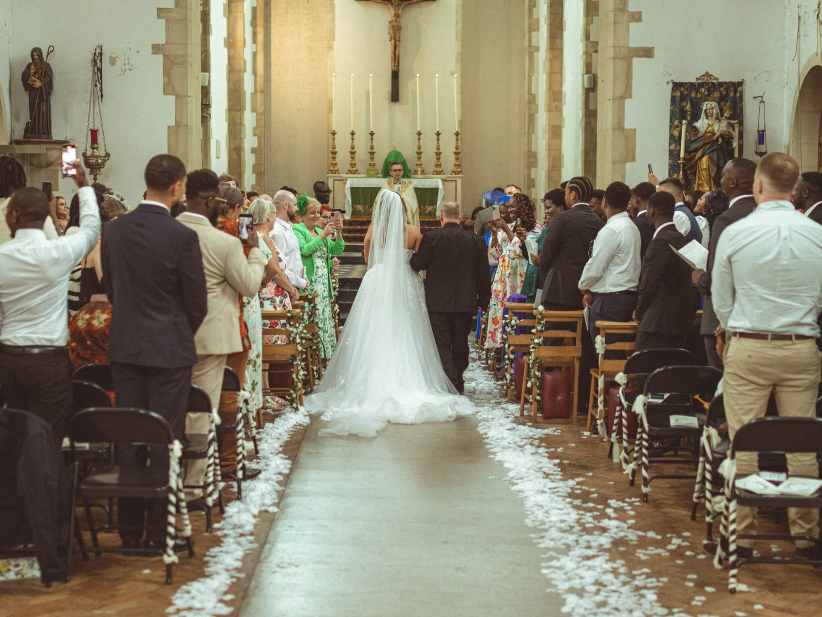 Bride walking down the aisle during a church wedding ceremony